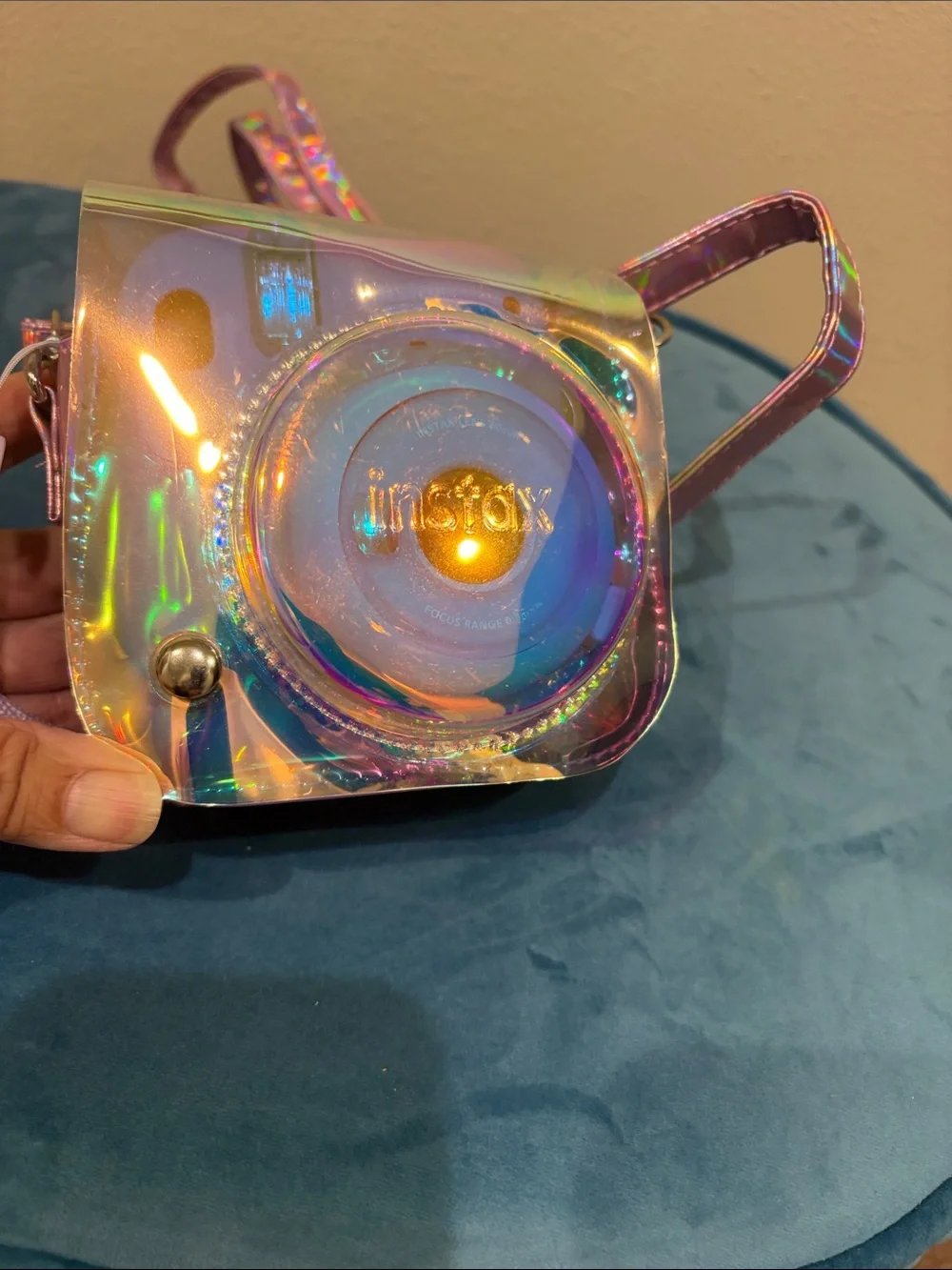 Fujifilm instax mini 11 camera with stylish metallic cross body bag.